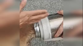 China: Dramatic Dog Rescue at Hangzhou Fire Station: Puppy's Head Stuck in Thermos Cup