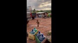 Toddler covered in mud wanders through garden