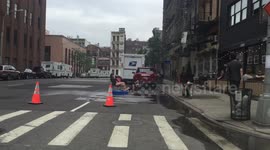 People in New York cool down using fire hydrant