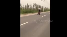 Man falls off motorbike during stunt