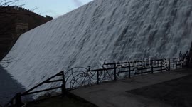 The famous iconic Derwent dam in Derbyshire UK flowing over. Dambusters.