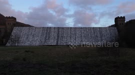 The famous iconic Derwent dam in Derbyshire UK flowing over. Dambusters.