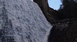 The famous iconic Derwent dam in Derbyshire UK flowing over. Dambusters.