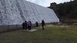 The famous iconic Derwent dam in Derbyshire UK flowing over. Dambusters.