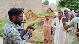 A Snake catcher rescued a Monitor lizard inside house in Haryana