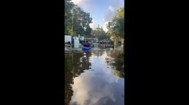 Boating through flooded streets in Dunedin, Florida