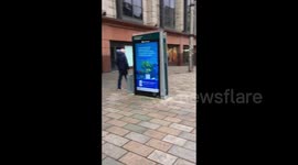 UK: At Buchanan Steps, engaging shoppers beside the floral display still there in tribute to all the lost souls of Gaza