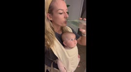 Baby Shares a Cold Drink With Mom