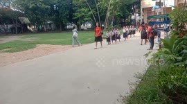 Cambodian students leave school in an orderly line