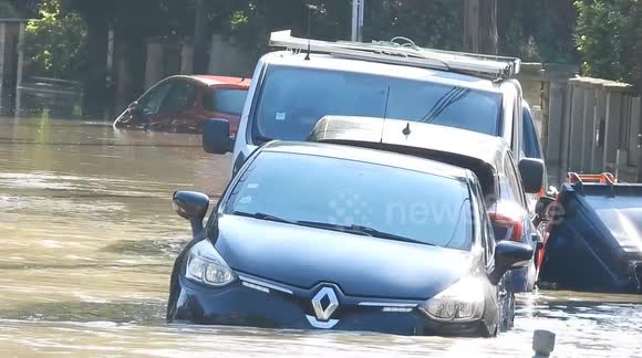 Parisians wade through floodwater as Hurricane Kirk remnants tear through France