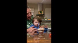 Grandson hilariously attempts to eat lit candle giving grandpa a scare in Argentina
