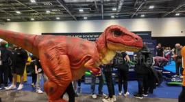 A T Rex grabs a quick selfie with a human at this years New Scientist Live