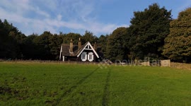 Secluded log cabin in the Derbyshire countryside in late summer. 4K