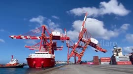 Huge gantry crane topples onto shipping containers at port in Taiwan