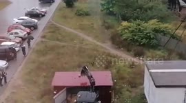 Russia: Digger Driver Tries To Help Kids Retrieve Ball From Roof With Mechanical Scoop And Punctures It Instead
