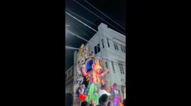 Two people fall from moving statue while attempting to clear cables