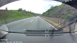 Car spins out of control on wet road in Malaysia