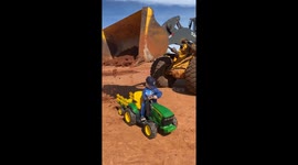 Boy Gets Toy Tractor Loaded by Real Excavator