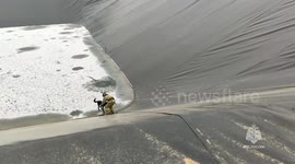 Russia: Three Dogs Rescued After Spending Days Stuck At Bottom Of Slippery Sided Artificial Reservoir