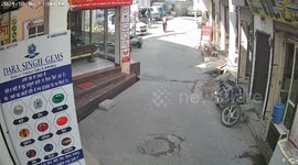 India: Shoking moment captured CCTV footage School bus full of children rolls backwards and hits steps causing two to fall out in Haryana