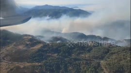 Helicopters battle fires being fanned by strong wind in Turkey