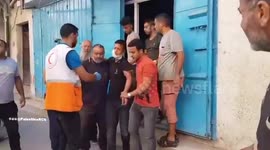 Palestinian Red Crescent teams transported two wounded people from the northern Gaza Strip town of Jabaliya to the Al-Ahly Baptist Hospital after the area came under artillery fire from IDF