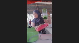 Shocking moment: Beverage vendor in Indonesia electrocuted by cup sealer