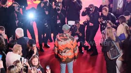 Pharell Williams braves the red carpet with laryngitis he arrives for European premiere of film 'Piece by Piece' at London's Royal Festival Hall