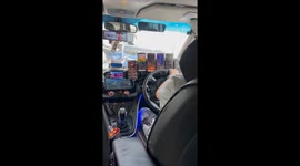 Multitasking Taxi Driver