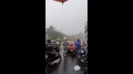 Motorists Join Forces to Lift Motorcycle Through Deep Floodwaters in Sorsogon City, Philippines