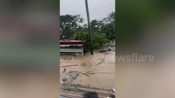 Flood swallows homes as Severe Tropical Storm Trami batters the ...