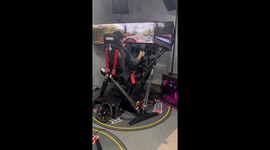 Man enjoys racing simulator in China
