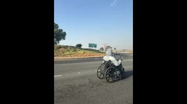 Wheelchair-turned-motorcycle speeds down Midrand highway