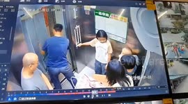 Terrifying moment fridge topples in elevator after cord gets trapped in door, falling onto woman protecting her baby