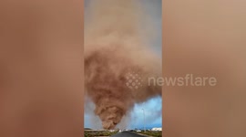 Sand tornado tears through desert in the UAE