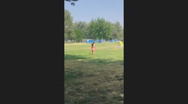 kids going to say hi to grandma when all of a sudden the dog crashed into one of the kids and falls to the floor.