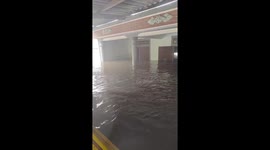 Locals use boat to transport possessions out of their homes as floodwaters reach 2 metres in Vietnam