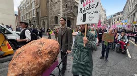 Extinction Rebellion wheel giant potato through London as group announces week-long protest
