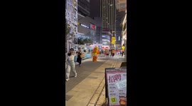 Mascot wearing inflatable costume blown around by wind in China