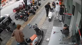 Chinese man struggles with faulty e-bike on street