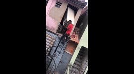Fridge mishap on narrow stairs in Fortaleza