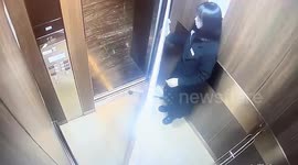 Woman traps herself in elevator with whiteboard, leaving her unable to reach control buttons