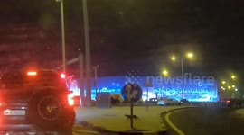 Cat caught on car dashboard camera roaming aimlessly on Qatar roads, trying to cross the road make a hasty retreat after seeing the cars at the singal crossing