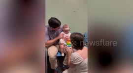 Baby born completely deaf hears his parents' voices for the first time