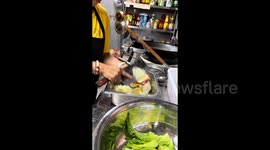 Chinese chef impresses as she slices potatoes with robot-like precision and speed