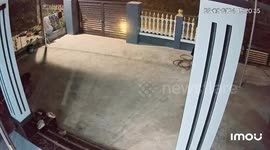 The man driving a motorbike traveling at high speed collides with a sidewalk and flies onto the road