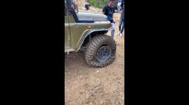 Chinese man repairs dented tire by using fire to heat up the dent