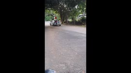 Doll hanging from car boot creates a funny scene in Tegucigalpa