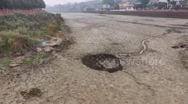 Mystery as 100-acre reservoir in China suddenly drains, leaving giant sinkhole and missing fish