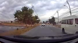 Advertising sign blows into oncoming car